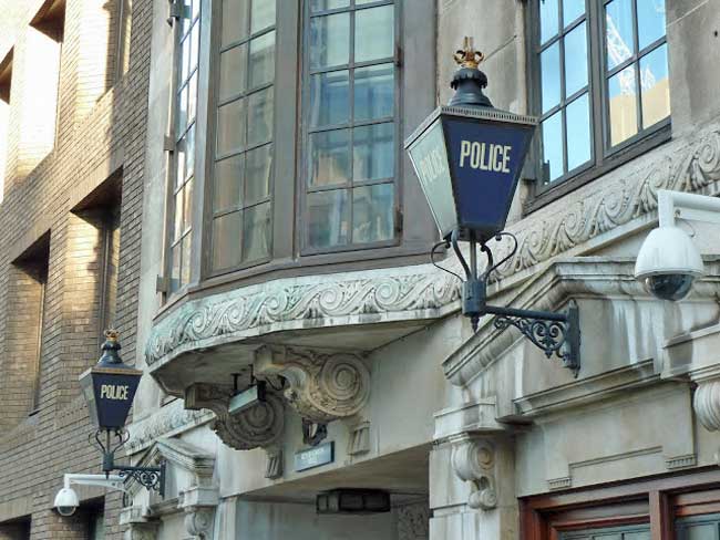 Entrance of Snow Hill police station flanked by resplendent lanterns, now sadly removed as the station has recently been decommissioned by the City of London Police