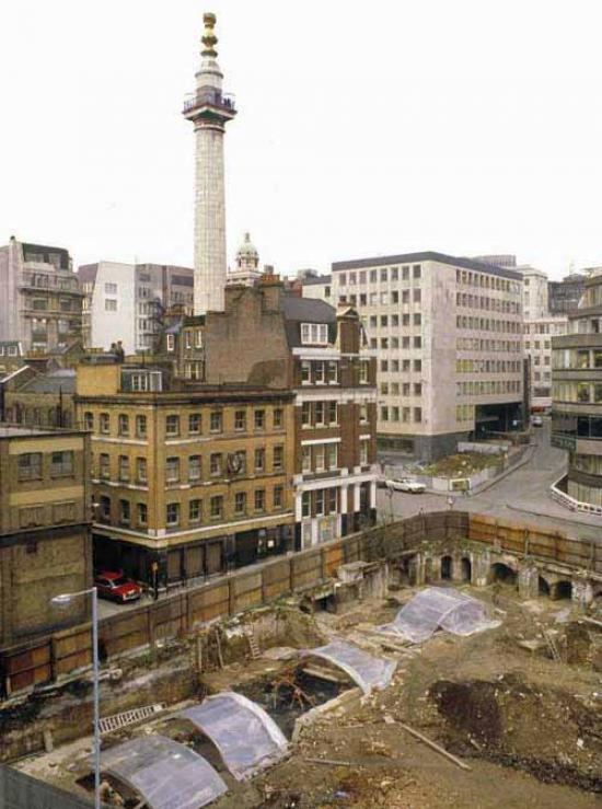 Archaeological excavations on eastern side Pudding Lane, looking NW. Thomas Farriner's bakehouse would have lain partially under northernmost shelter: the cellar next door exposed in the centre was fully excavated in 1979 (PEN79) (c Museum of London)