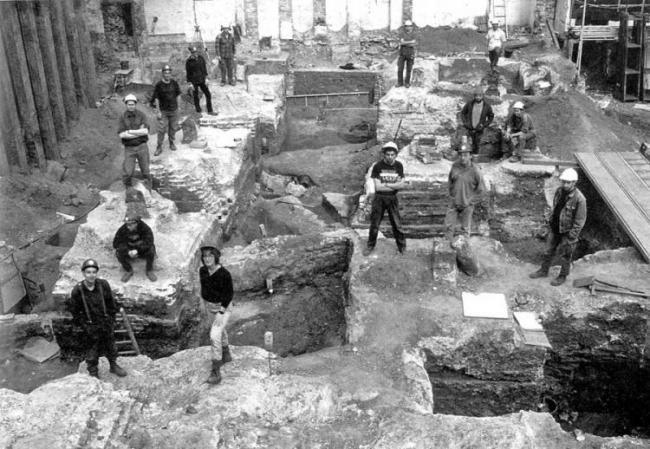 71 Fenchurch Street, London EC3 (FCC95) The excavation team gathered on the concrete plinths of the recently demolished Haddon House in trench 2, one of five areas excavated on site. Clockwise from front: Carrie Cowan, Simon Cox, Chris Pickard, Howard Burkhill, Dickie Bluer, Dave Mackie, Andy Daykin, Raoul Bull, ??, Stuart Gibson, Richard Turnbull, Ken Pitt, Mike Edwards, Ian Blair  (Photo by permission: MOLA © MOLA)