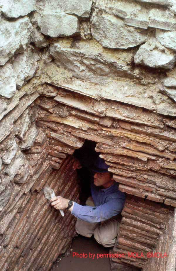 Andy Daykin in the entranceway into the shorter north end of the culvert, from the square access or drop shaft.