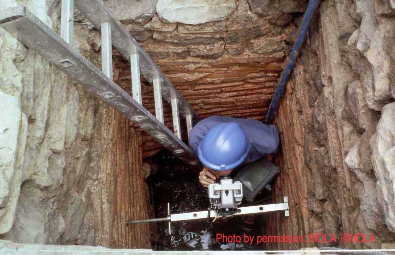 Steve Every surveying the north end of the culvert from the access shaft, Duncan Lees is out of shot in the darkness