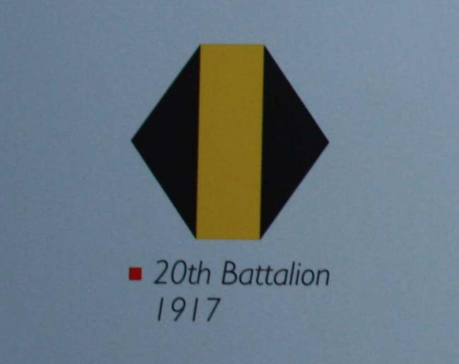 Comparable colour image of the 20th battalion Middlesex Regiment shoulder badge from 1917