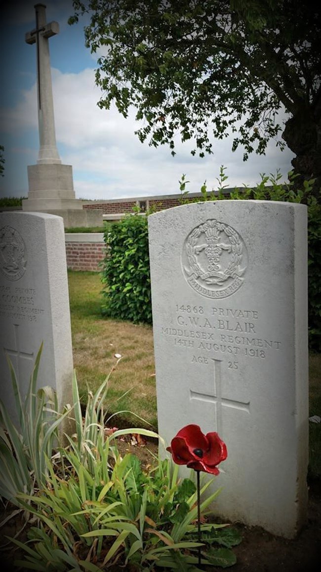 Journeys End - Photo of the red poppy in front of GWR Blair headstone