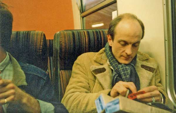 On the way home, Pete Cardiff desperately rolls more Gauloises, having already smoked his customs allowance