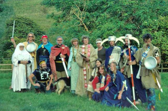 York university students (Viking invaders dressed in blue), Betty Ewins (The Abbess of Twitby), Nick Bateman (Saxon   warrior), Maurice Beresford (reporter from Anglo Saxon Chronicle), John Hurst (King Egghurst), Chrissie Harrison (Queen   Egghurst), Warwick Burton (Archbishop of Banterbury), Gustav Milne (Orator), Paul Herbert (Saxon warrior), with   Wharramites John and Vikki Watts (seated)